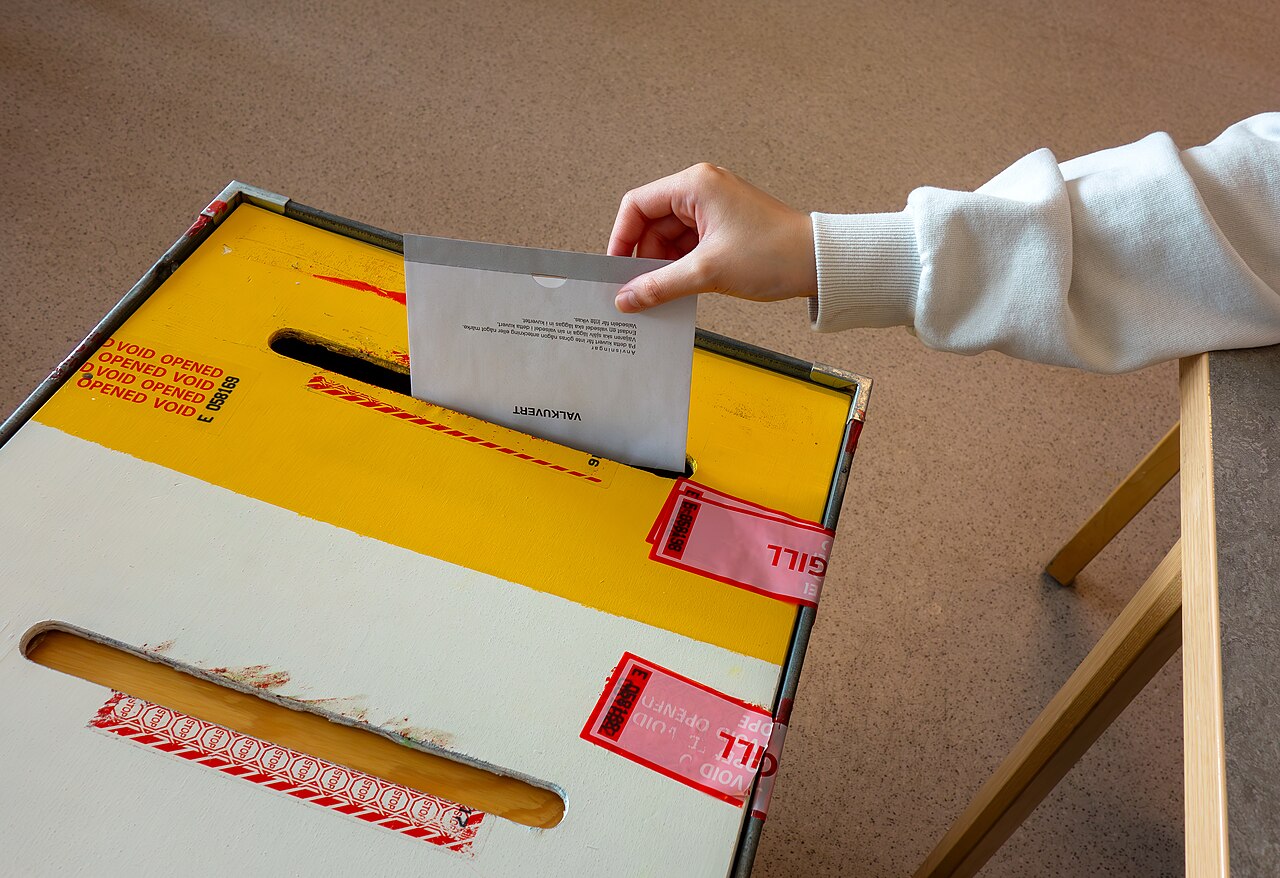 Voter casting a ballot at a European election polling station